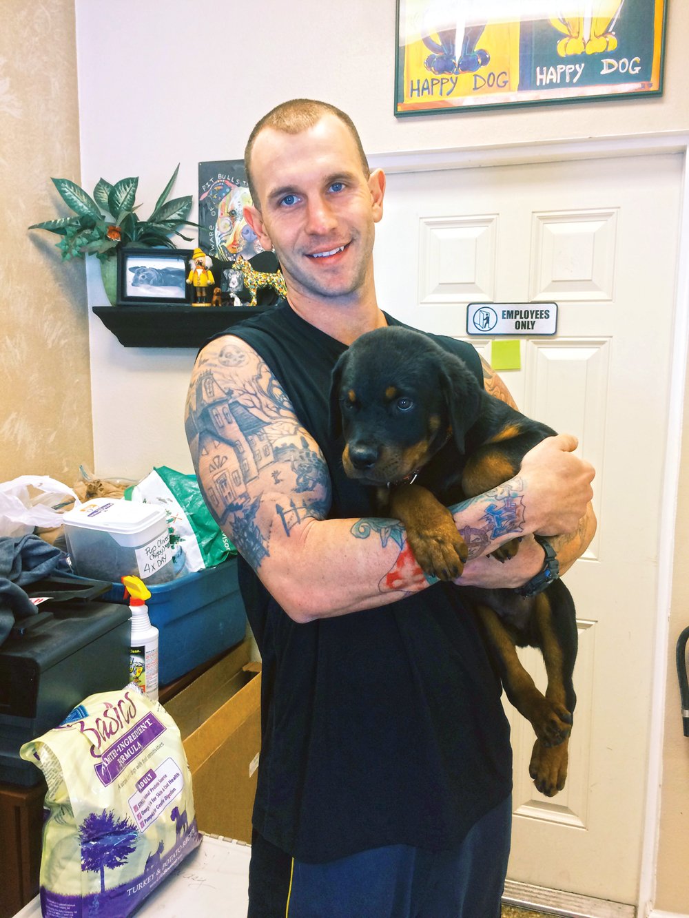 Andre, a former work release staffer and soon to be head of Special Services, with his rescued puppy Cujo