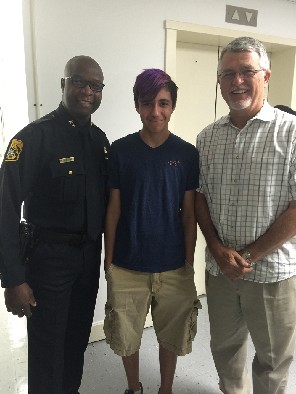 Left, Tampa Police Chief Eric Ward hosted a BBBS tour of his department. Center, Little Brother Logan and right, Big Brother and Green Bench Monthly Contributor, Andy Bragg.