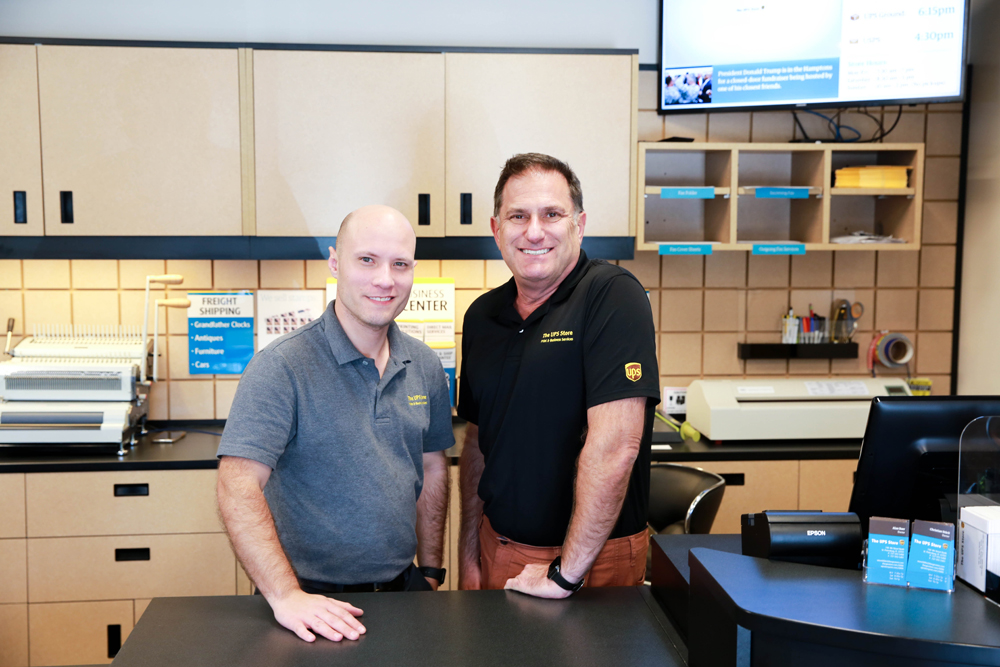 Christian Stuck and Alan Baer, owners of The UPS Store on 4th St in Historic Uptown. Photo by Emily Canfield.