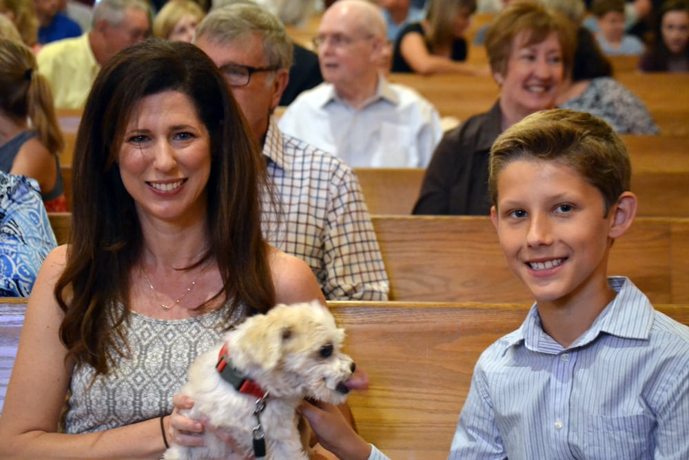 Michelle and Everett Jennings, brought Bennie to St. Thomas’ for the Blessing of the Animals service. Photo by Pippa Mpunzwana.