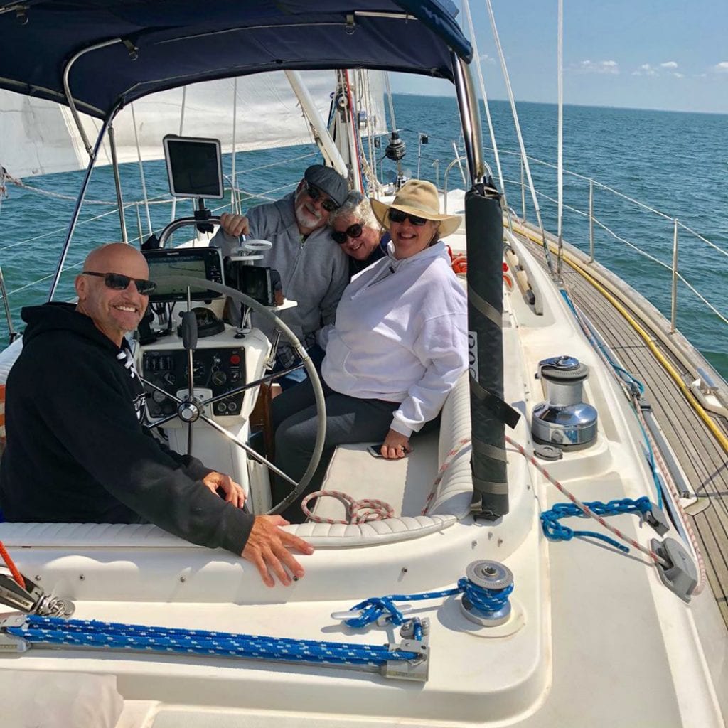 Timebankers using hours to charter a private ride on timebanking member Fred Levine’s boat.