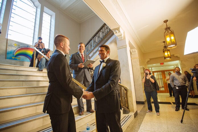 On January 6th, 2015 Dr. Bob Wallace and JoJo Brian Reibel - Wallace were married inside St. Pete’s City Hall. Ceremony officiated by Mayor Rick Kriseman. Photo by City of St Pete