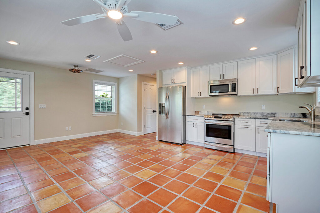 One bedroom carriage home with Saltillo Terracotta floor. Photo courtesy of Tiger Construction